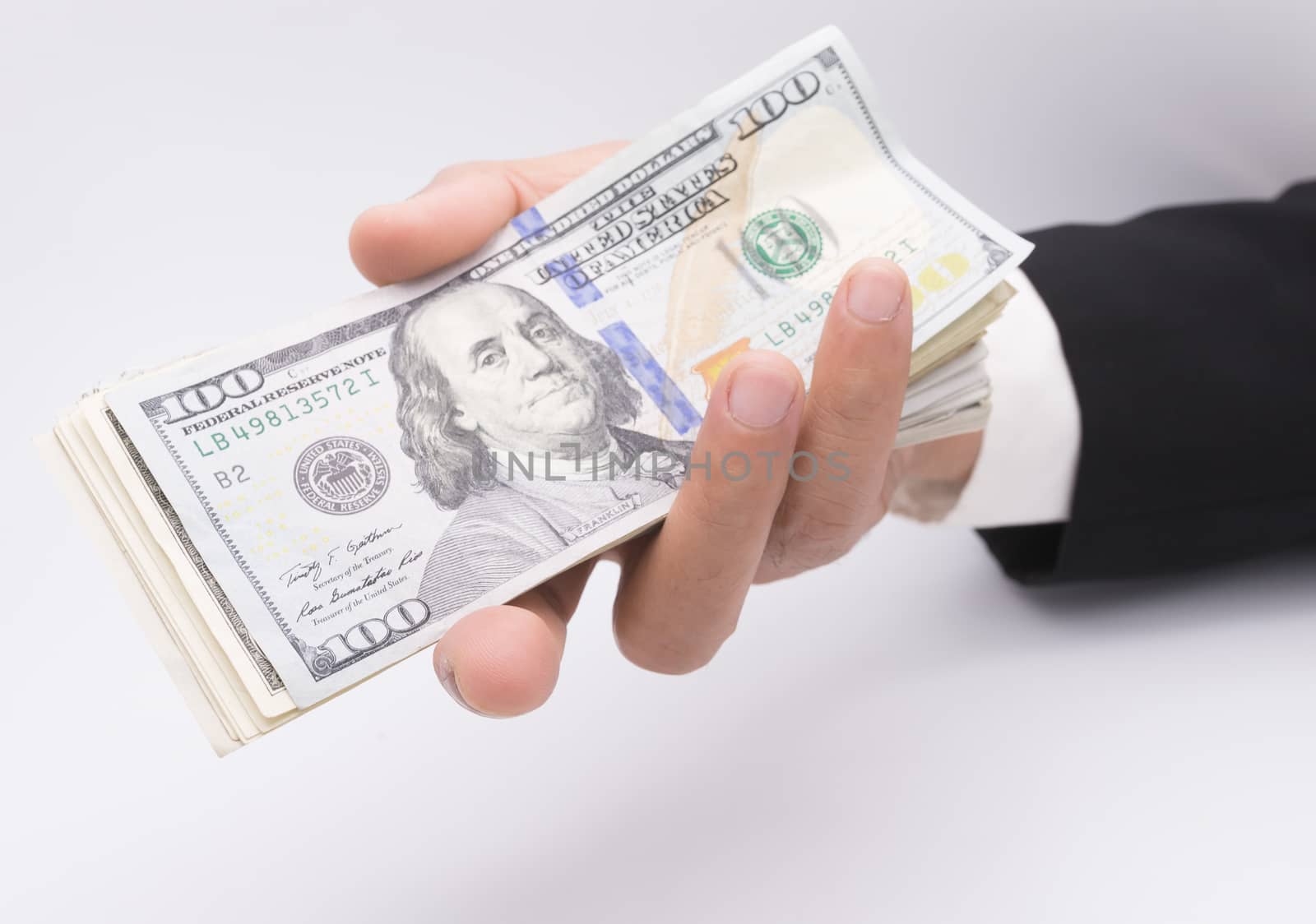 US dollars in business hand isolated on a white background by frank600
