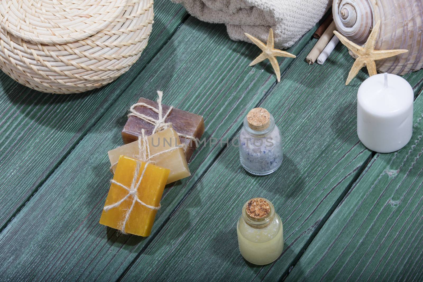 spa setting with essence oil,natural soap,soft towel by senkaya