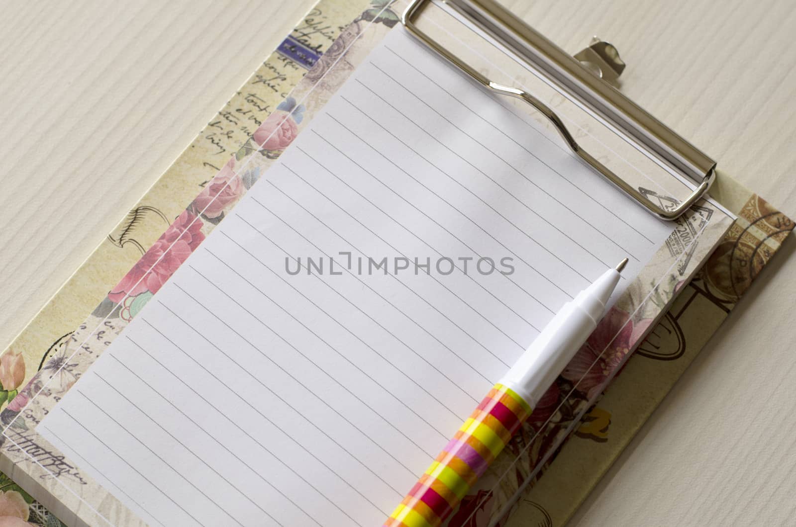 Notebook and pen on wood table and place for text