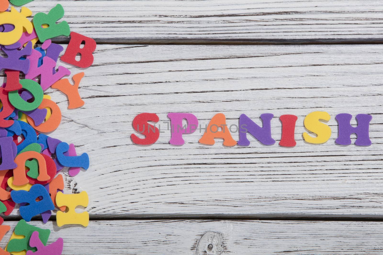 colorful words on white wooden background