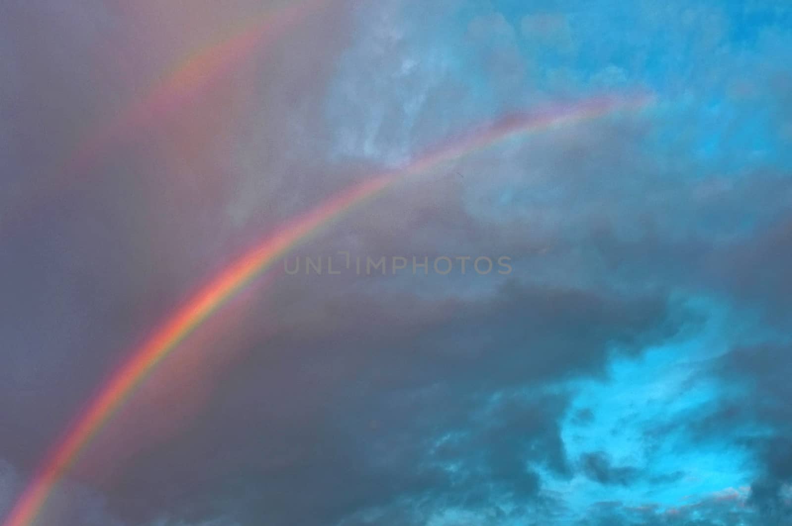 Rainbow over blue sky