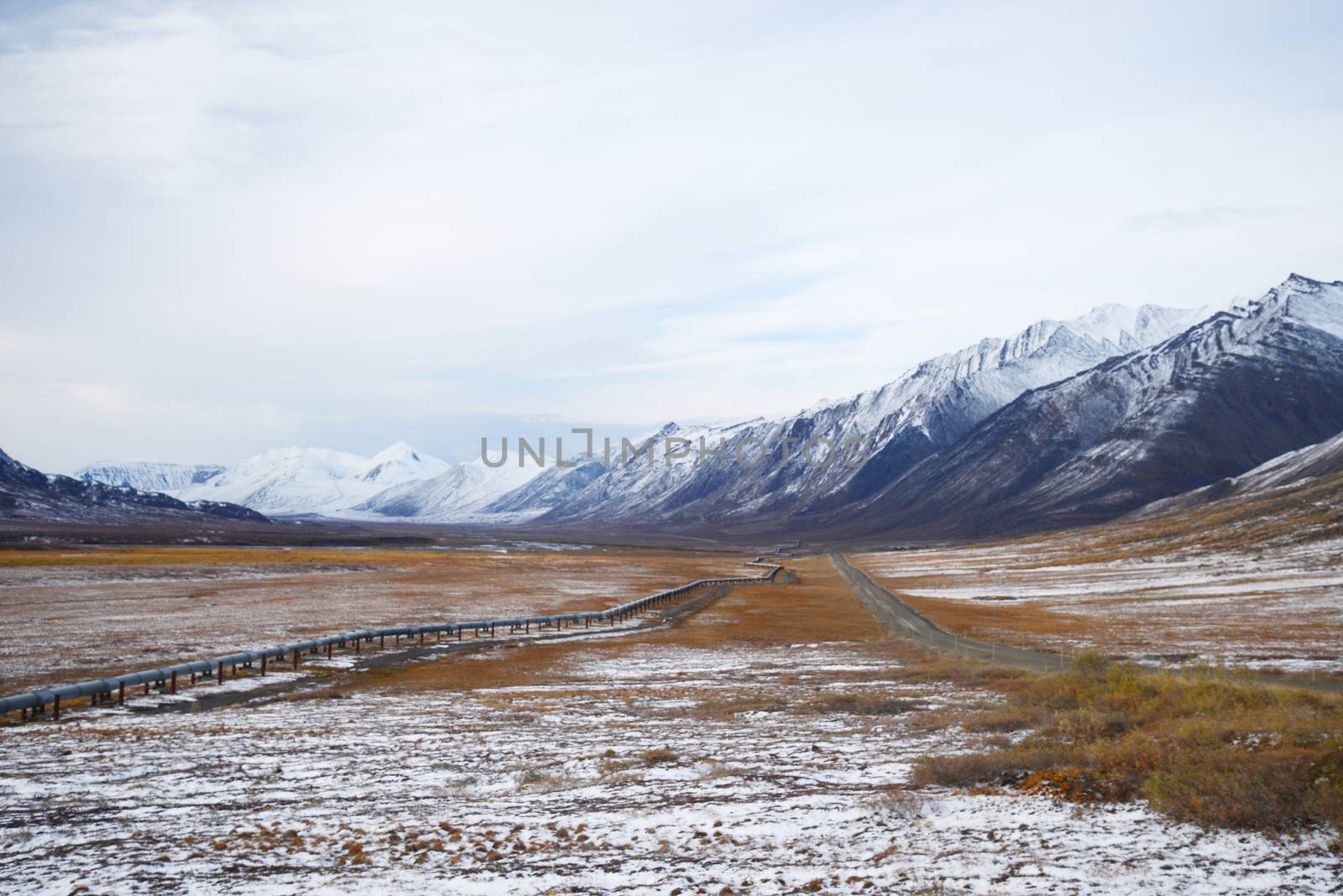 oil pipeline with mountain in northern alaska