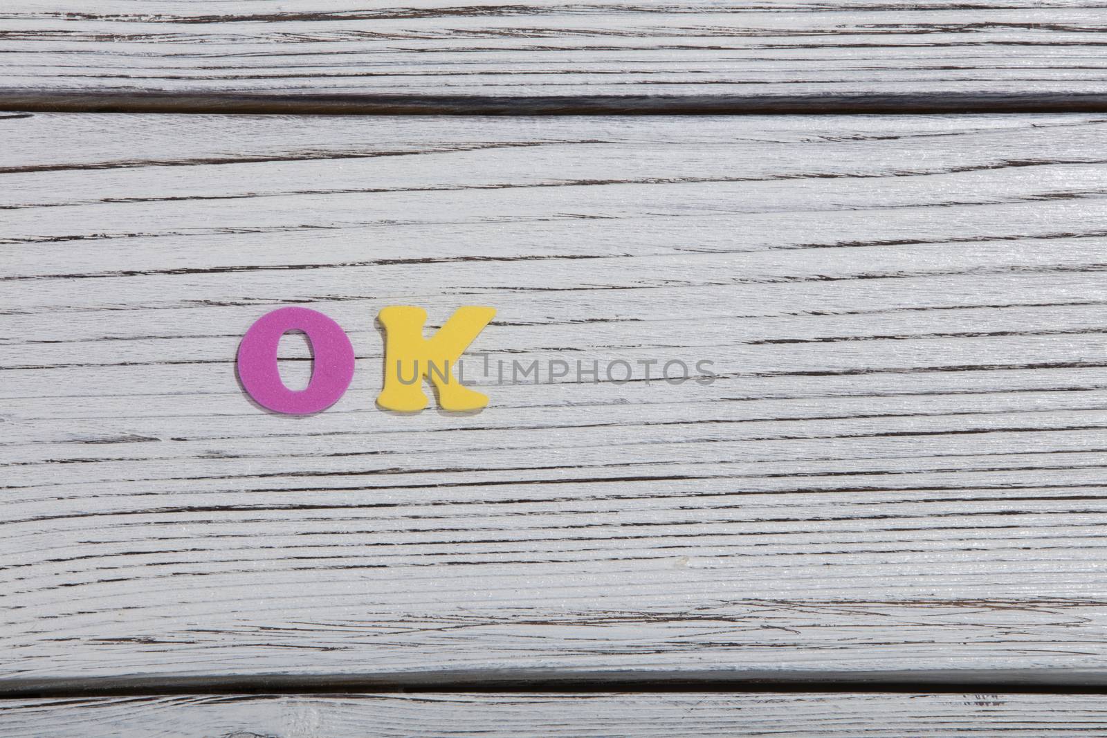 colorful words on white wooden background
