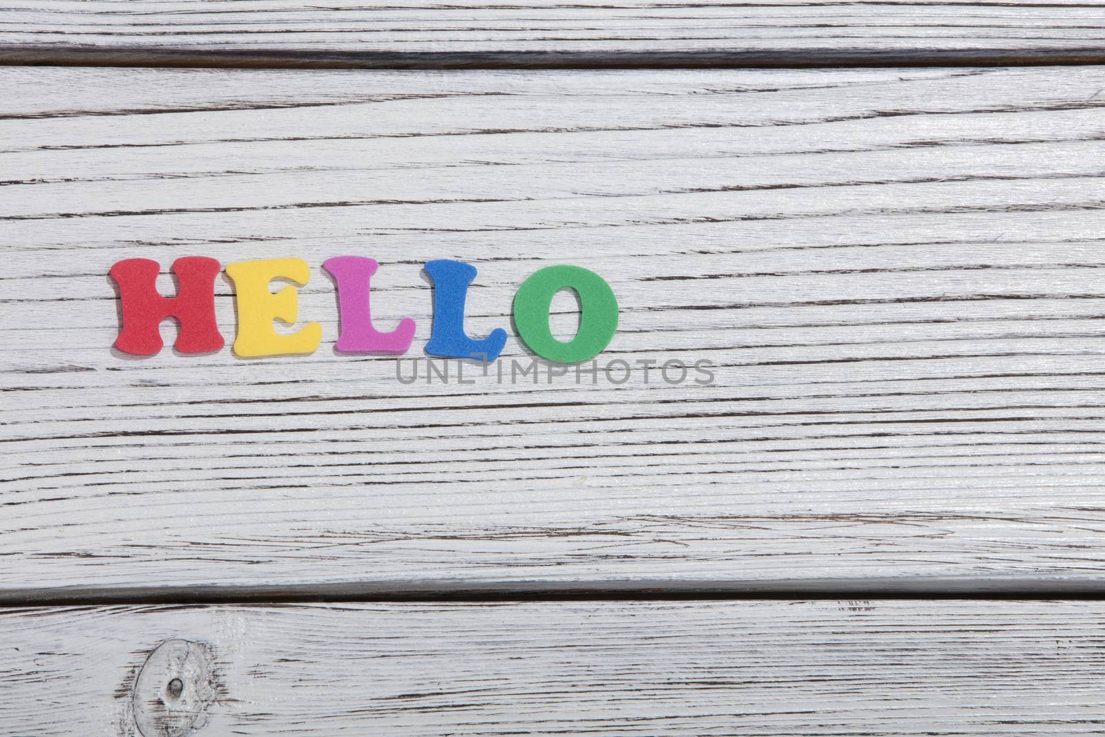 colorful words on white wooden background