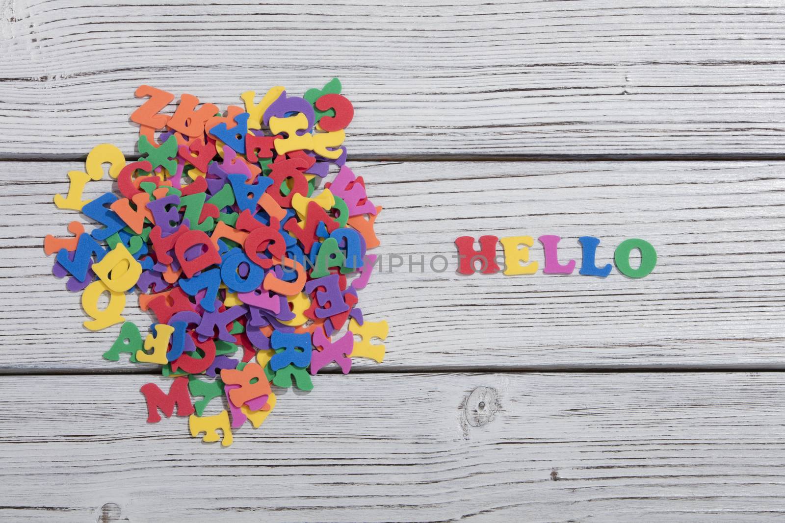 colorful words on white wooden background