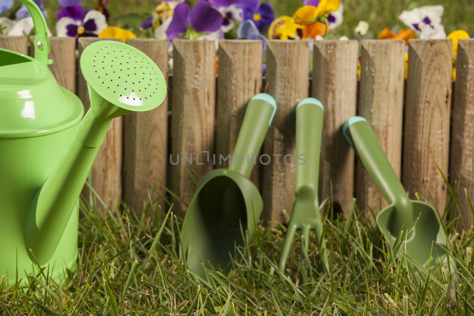 gardening tools on the grass in the garden by senkaya