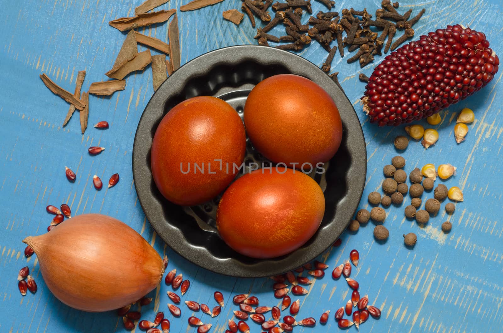 Eggs and ingredients for decoration, old painted blue Board.