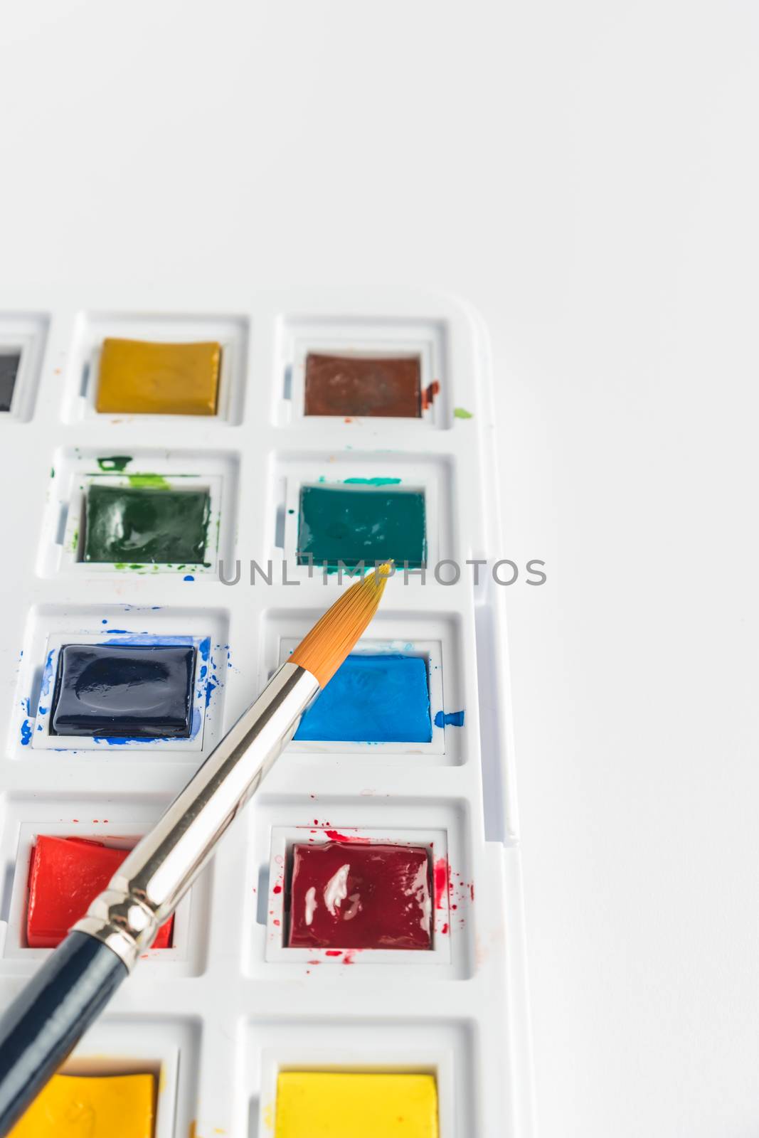 Box of watercolor paints, art brushes by AnaMarques