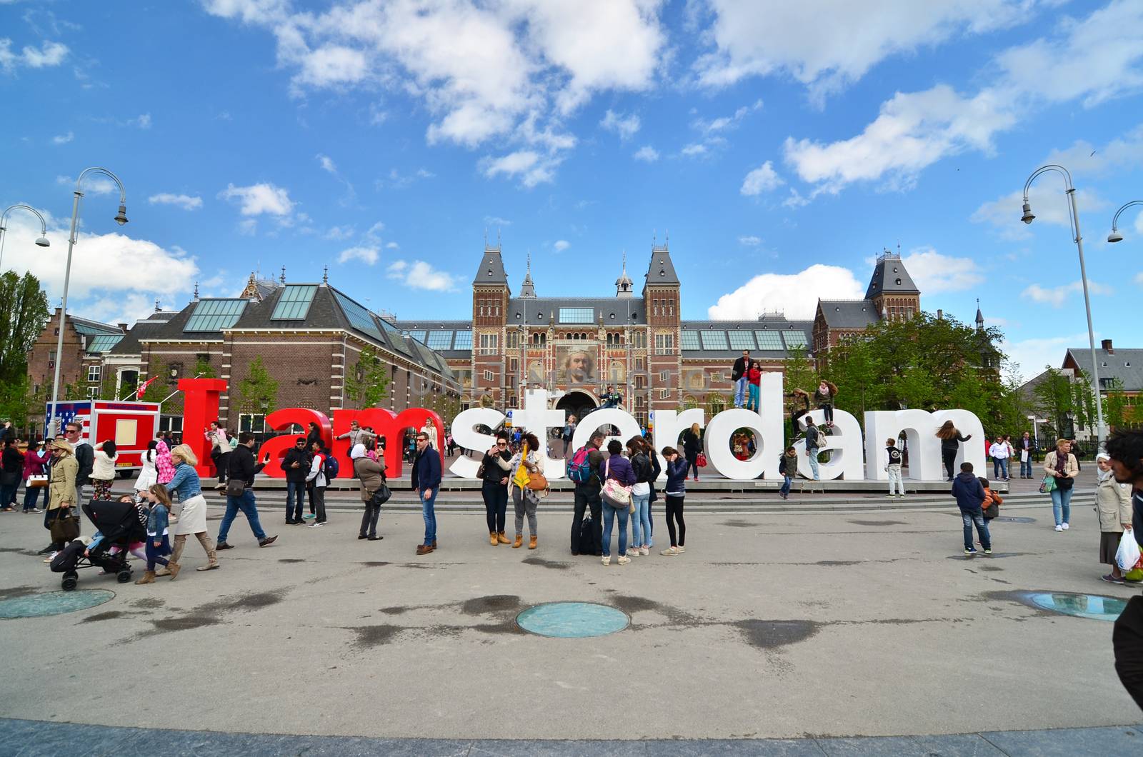 Amsterdam, Netherlands - May 6, 2015: Tourists at the famous sign "I amsterdam" at the Rijksmuseum in Amsterdam by siraanamwong