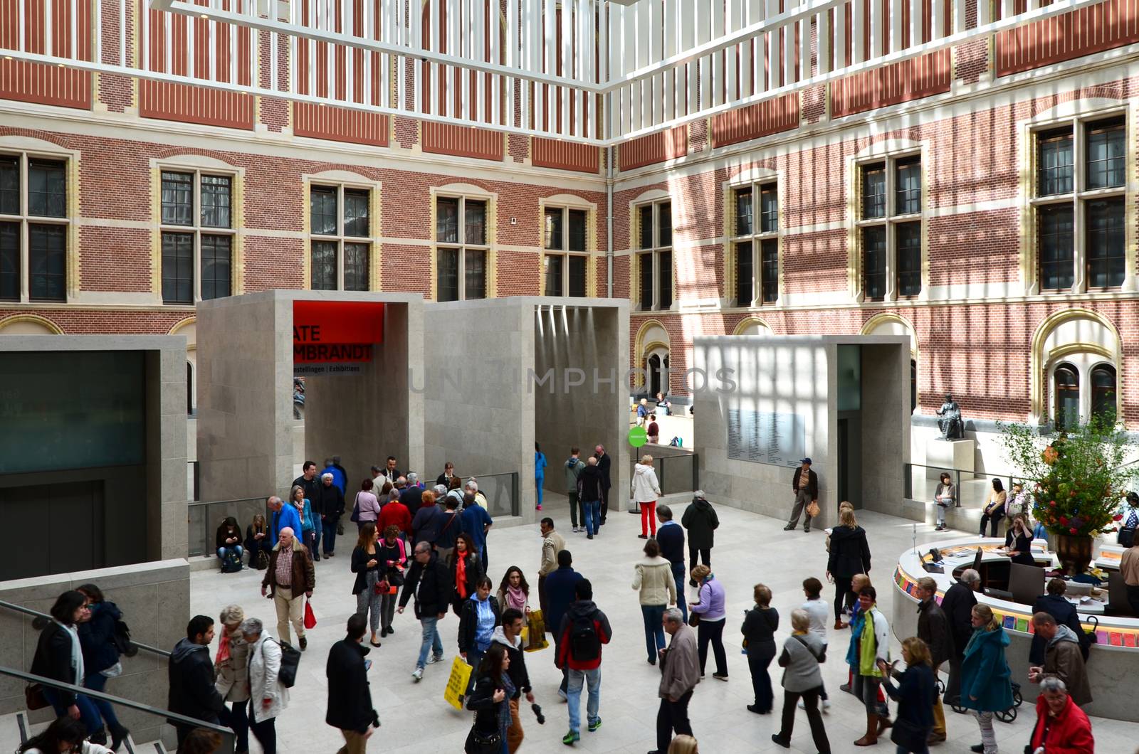 Amsterdam, Netherlands - May 6, 2015: Tourists in the modern atrium Rijksmuseum by siraanamwong