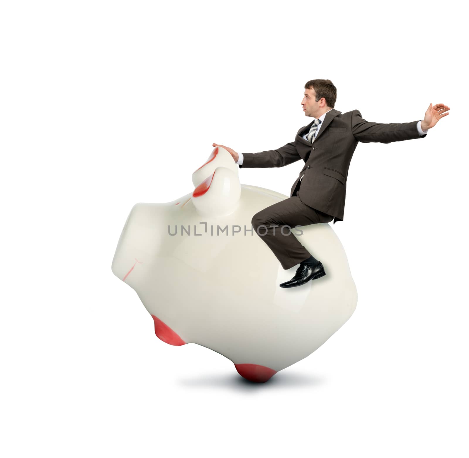 Businessman riding piggy bank isolated on white background, business concept