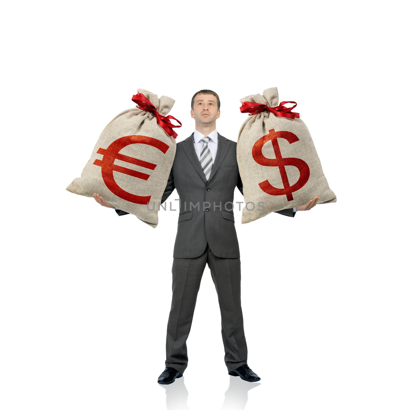 Businessman holding two money bags with dollar and euro signs isolated on white, money concept