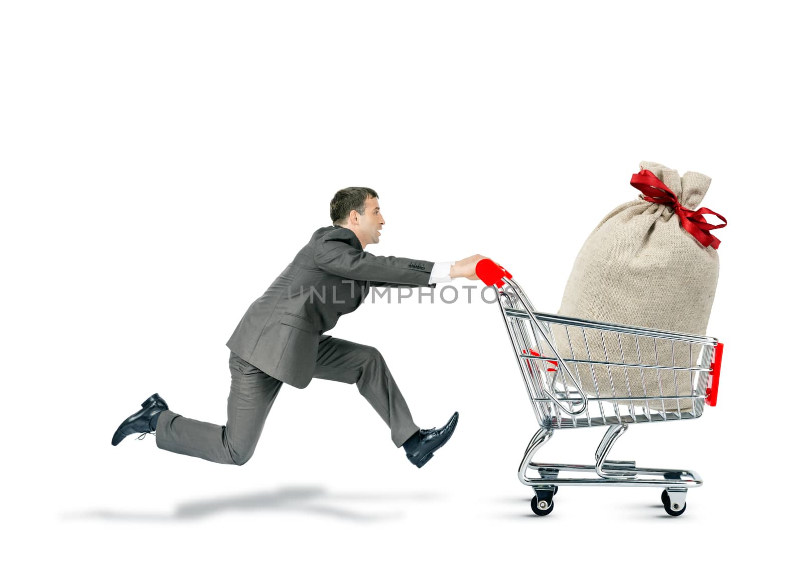 Businessman pushing shopping cart with money bag isolated on white background