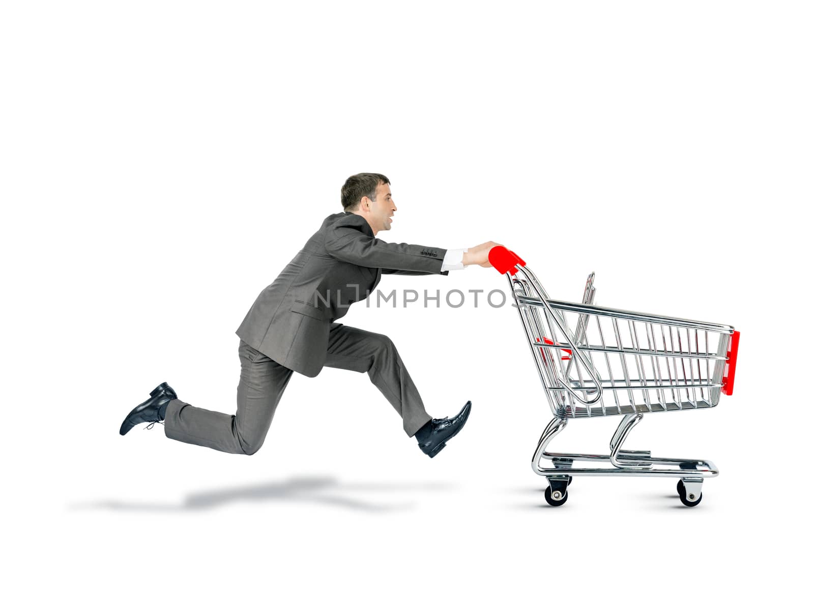 Businessman pushing empty shopping cart isolated on white background
