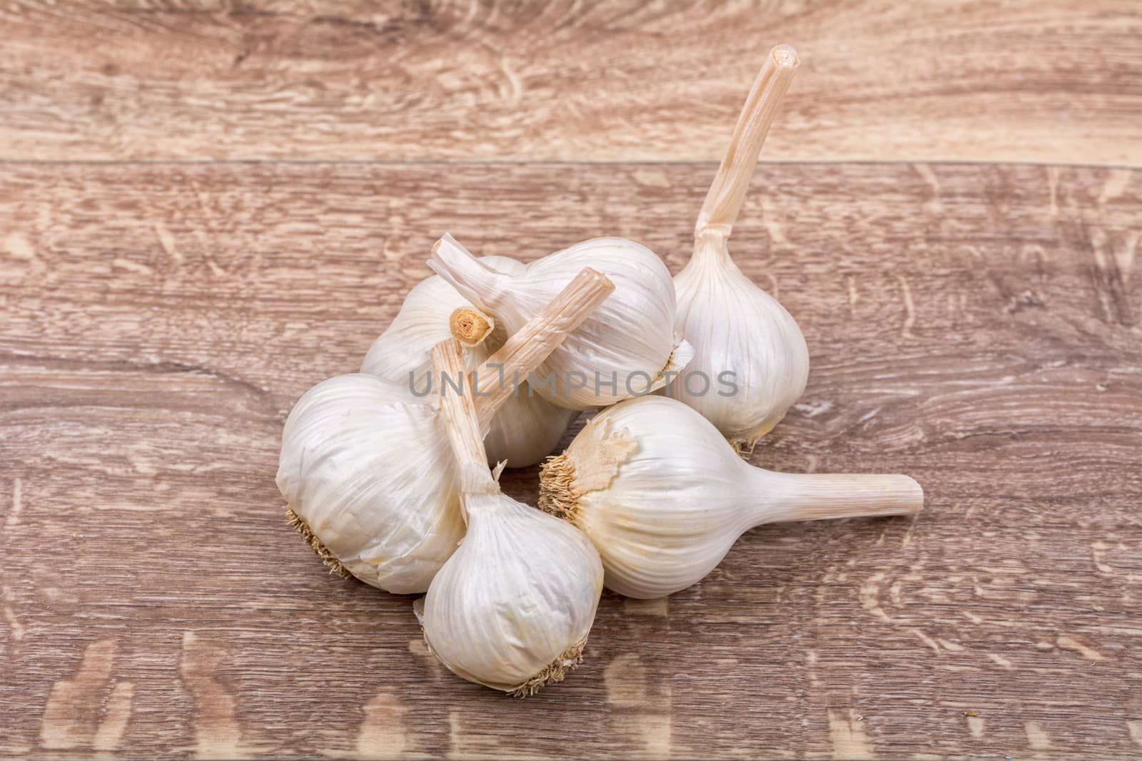 White garlic on a wooden background