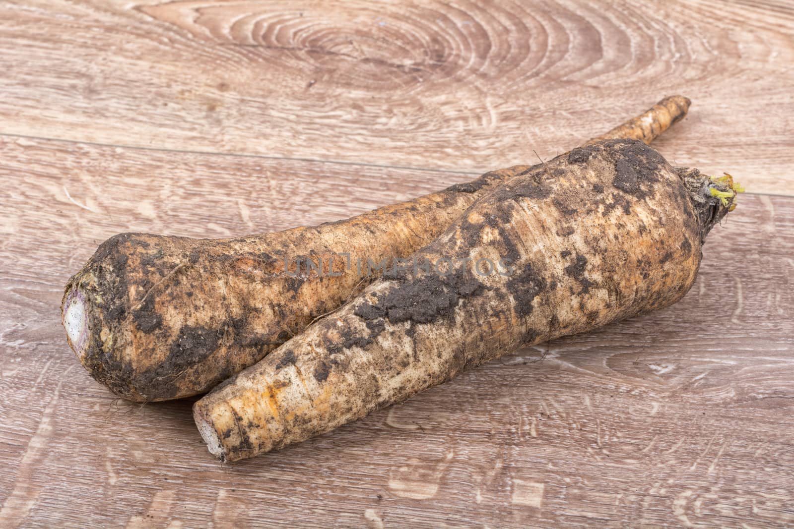White parsley on a brown wooden background