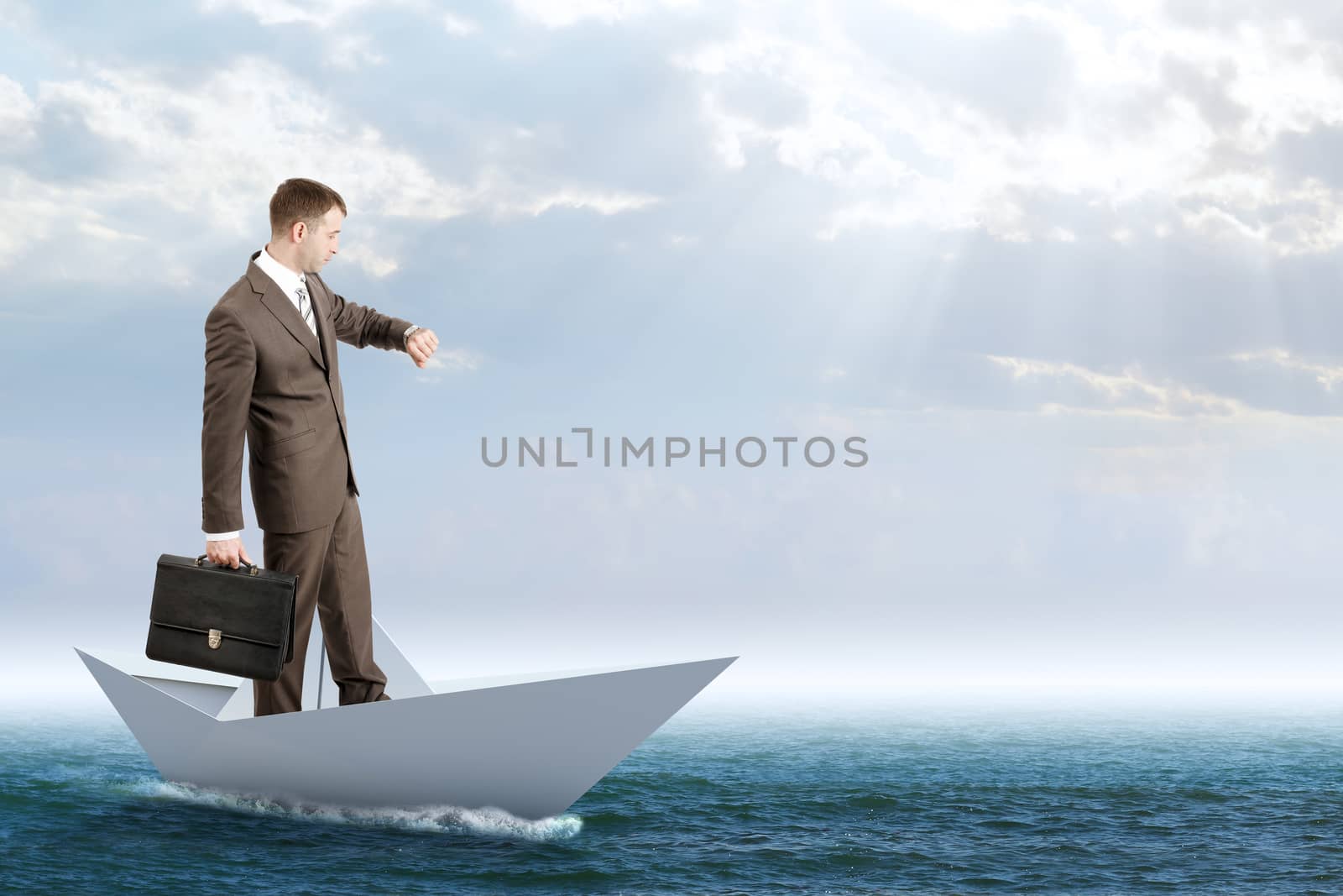 Businessman in paper boat by cherezoff