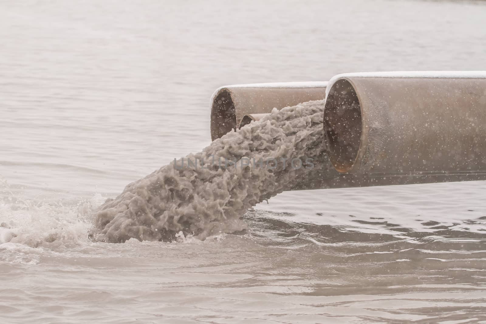 Dirty water discharged into river by olgagordeeva