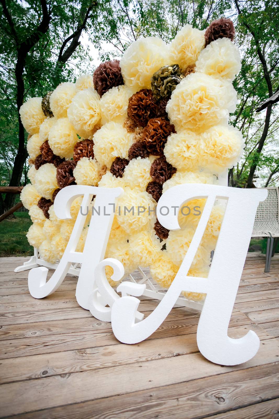 Flower pompon backdrop wall, wedding decoration zone with double letters a. Yellow white and brown color. by Maynagashev
