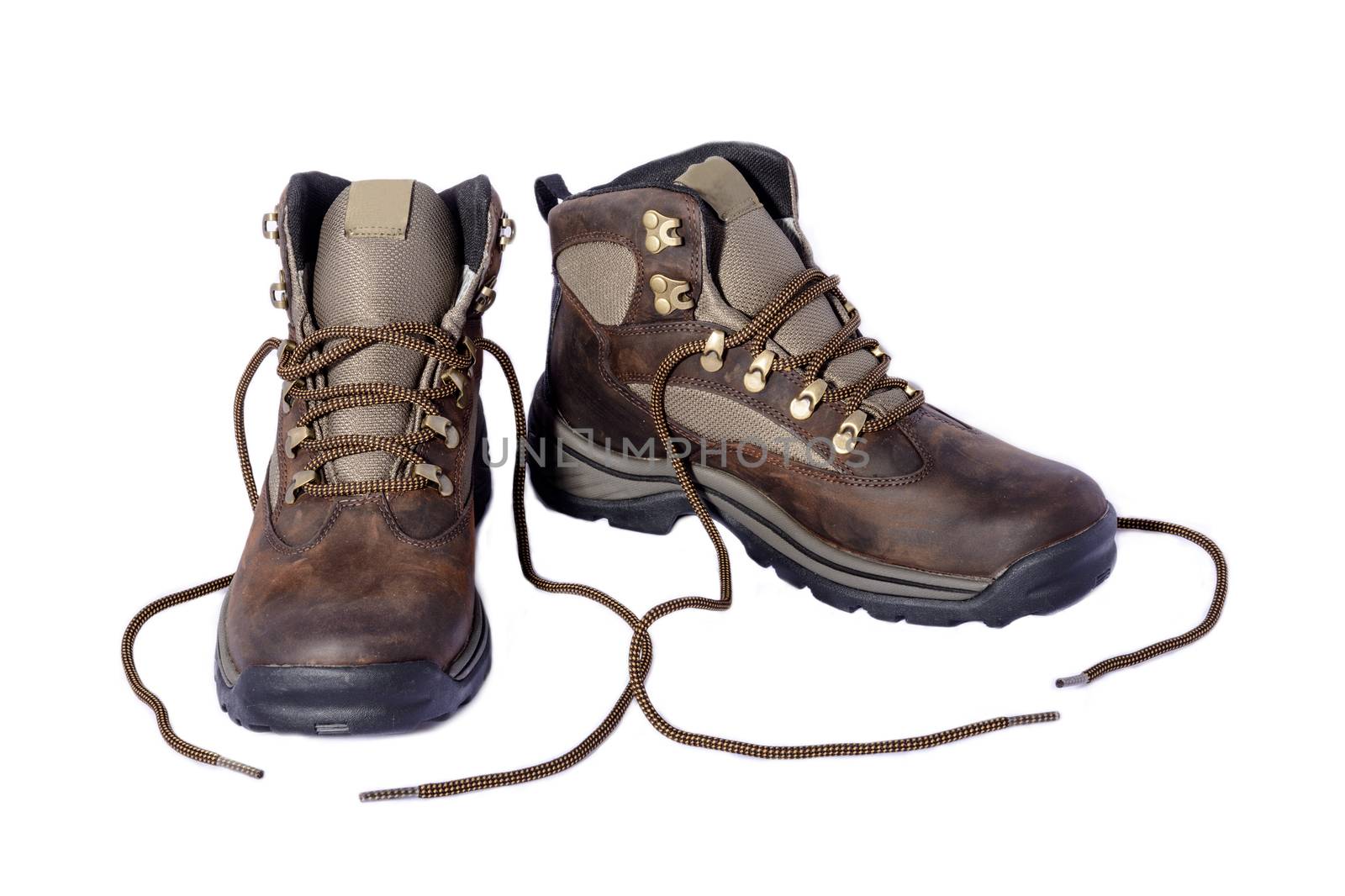 New hiking boots posing on white background.