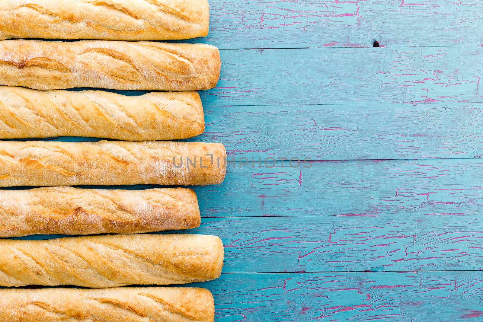 Border formed of a row of French baguettes by coskun