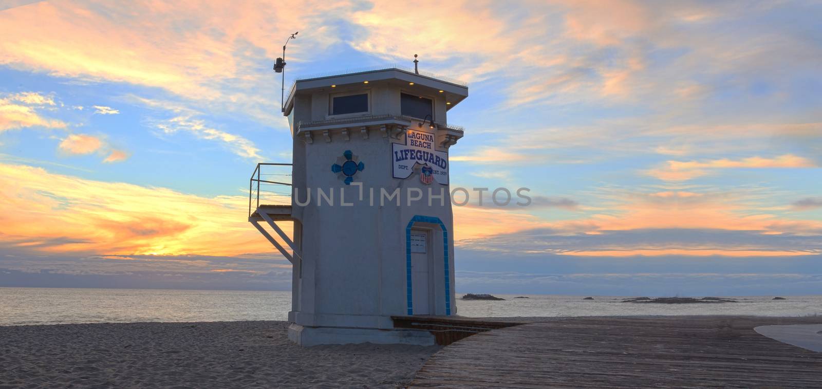 Lifeguard station on boardwalk at Main beach at sunset by steffstarr