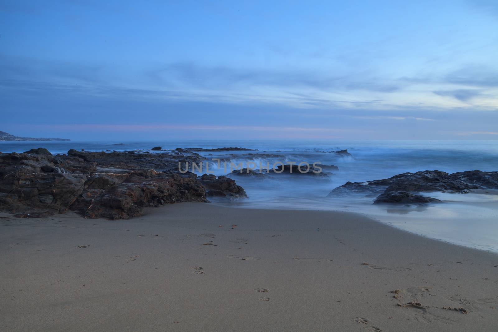 Long exposure of sunset over rocks by steffstarr