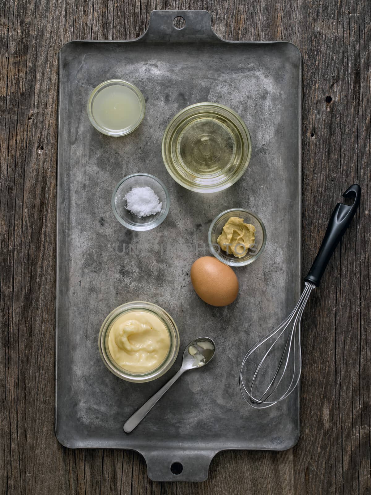 close up of rustic homemade mayonnaise and ingredient