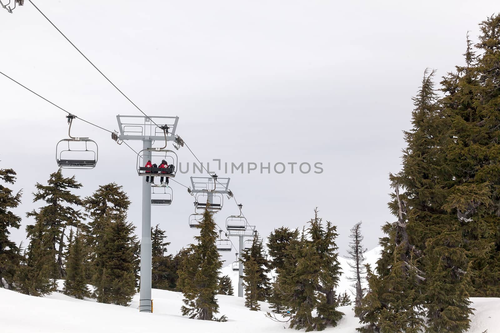 US Forest Service Rescue Crew Personnel Riding Ski Lift up to the Slopes of Mount Hood in Oregon