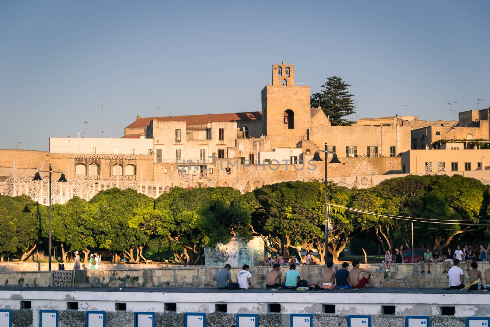Otranto, Italy - Monday 11, 2014: Tourists visiting the city of Otranto in Apulia vintage
