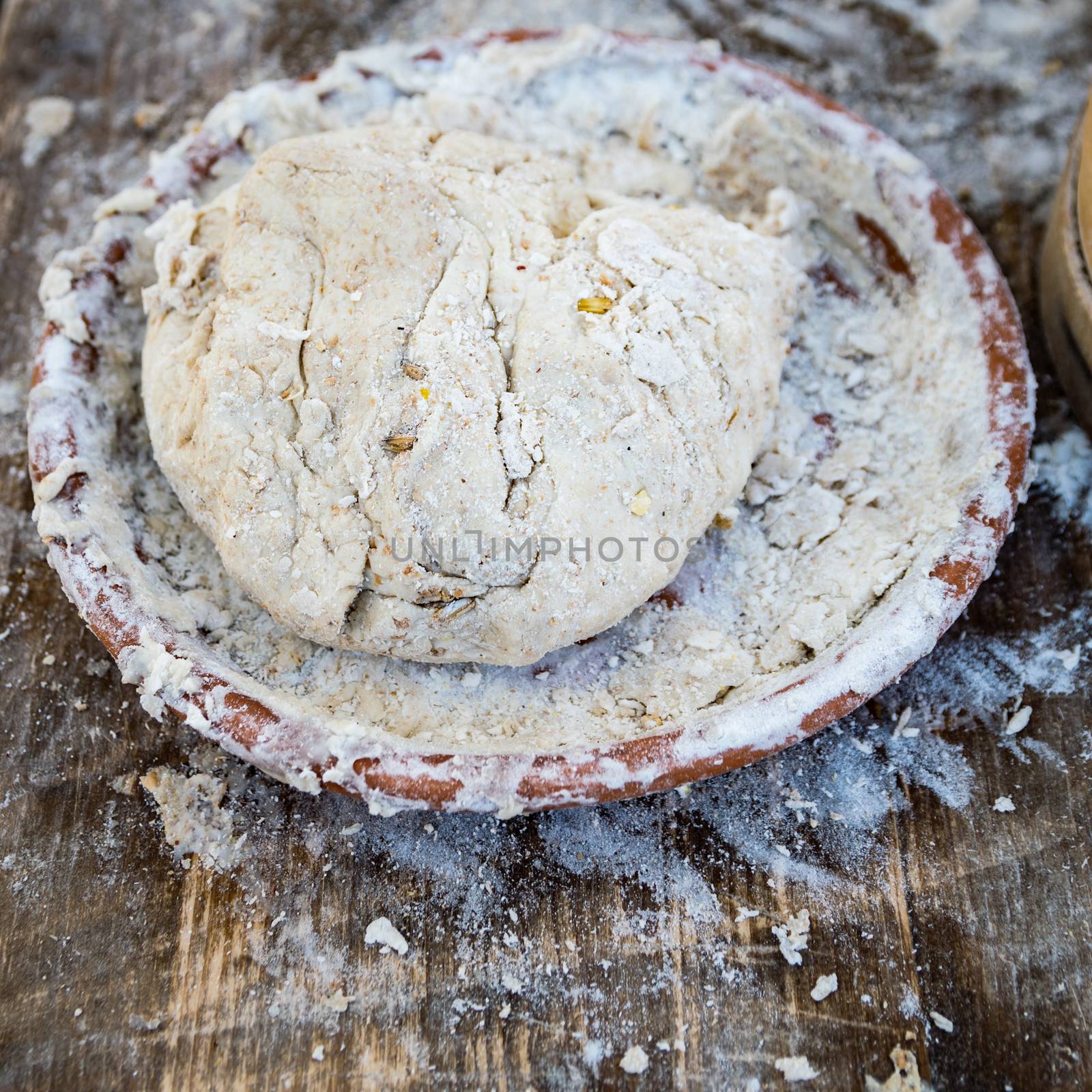 Bread kneaded by hand ready to be baked. by Isaac74