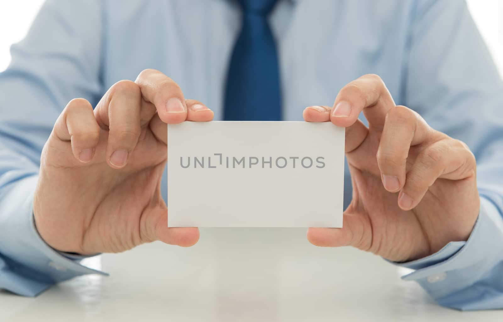 Sales show a business card to introduce itself to customers. free space for text.