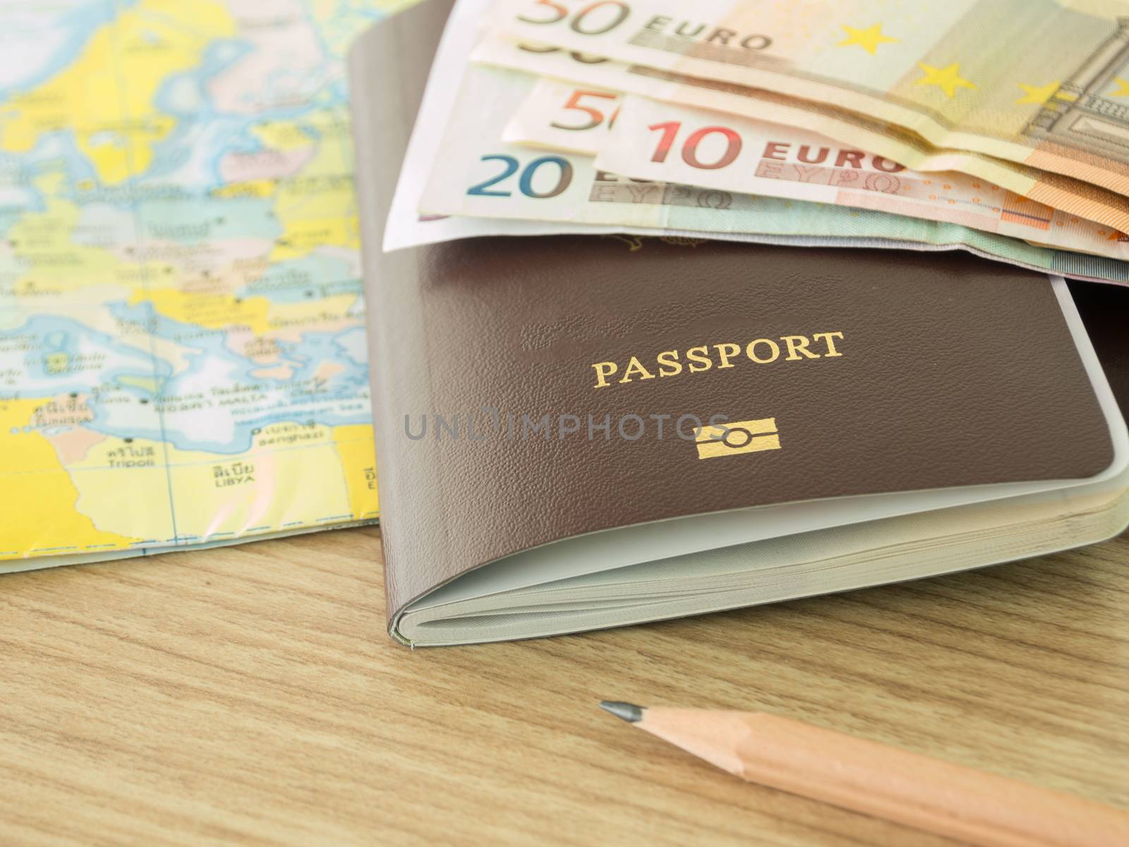 closeup passport on world map with banknote