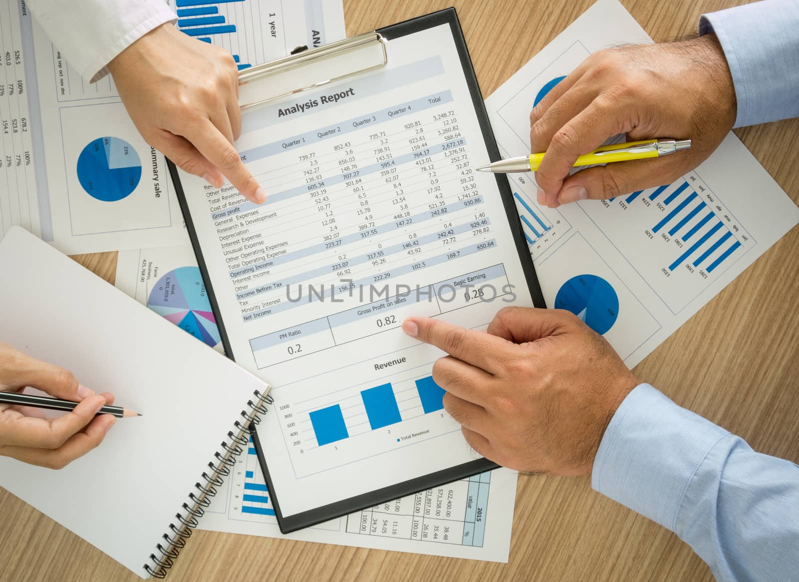 Businessmen are analyzing the data to business planning. top view.