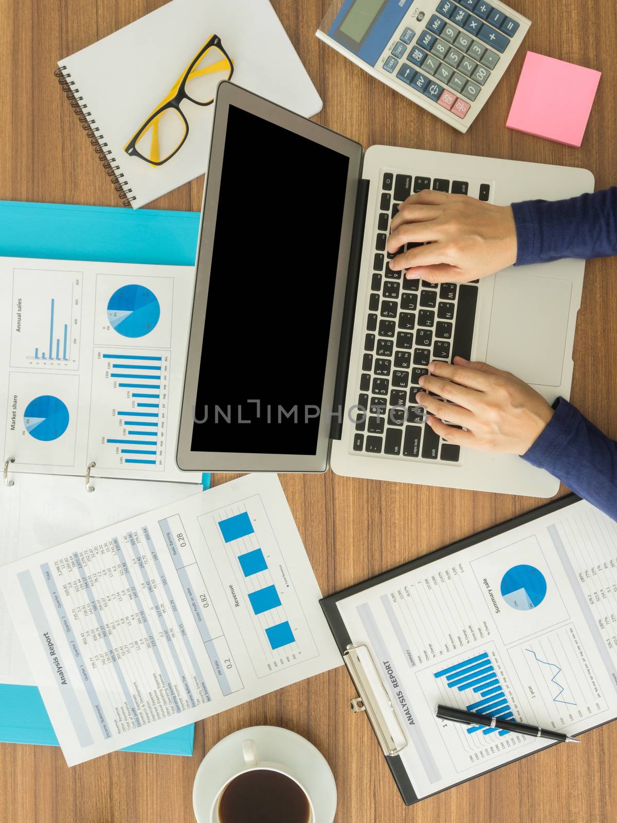 businesswomen hand working with digital laptop computer on wooden desk in office. top view