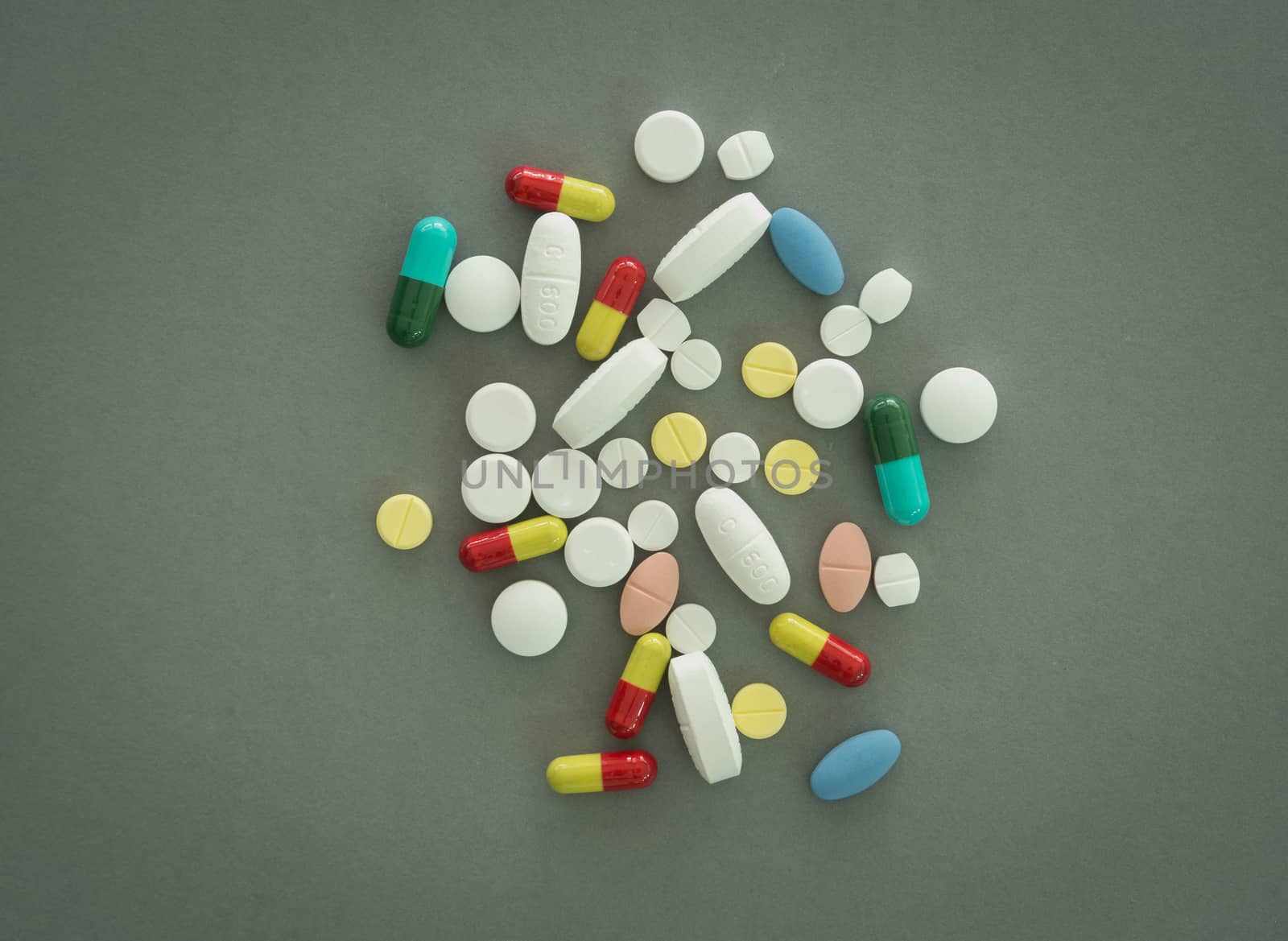 pills on gray background. view from above.