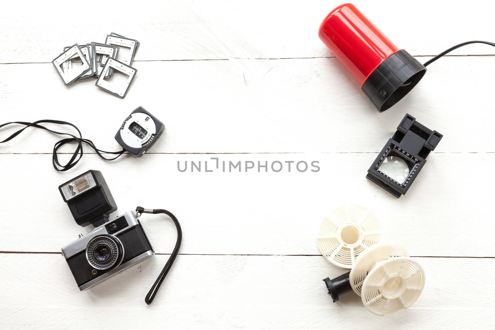 Elements related to developing photographic film in an old photo lab on white background view from above