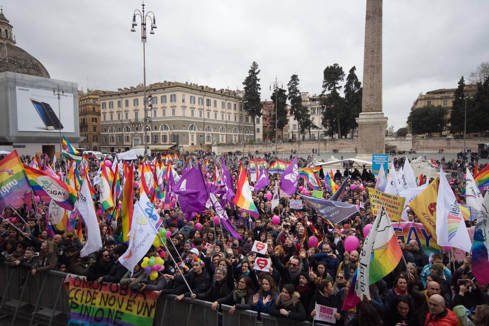 ITALY, Rome: Protesters wave LGBT flags during a demonstration held by LGBT associations to claim more rights in Rome, Italy on March 5, 2016.