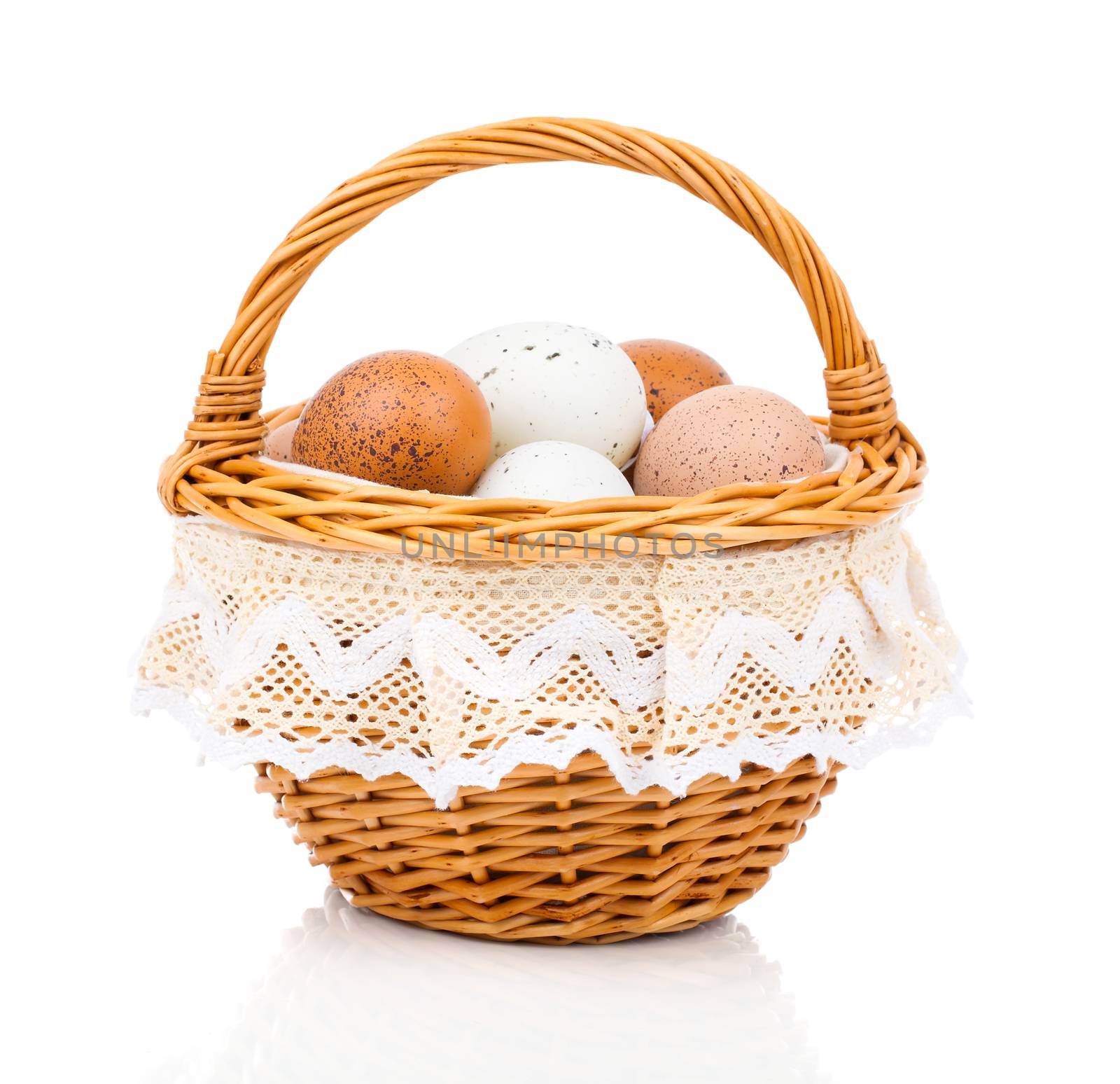 Eggs in basket isolated on white background