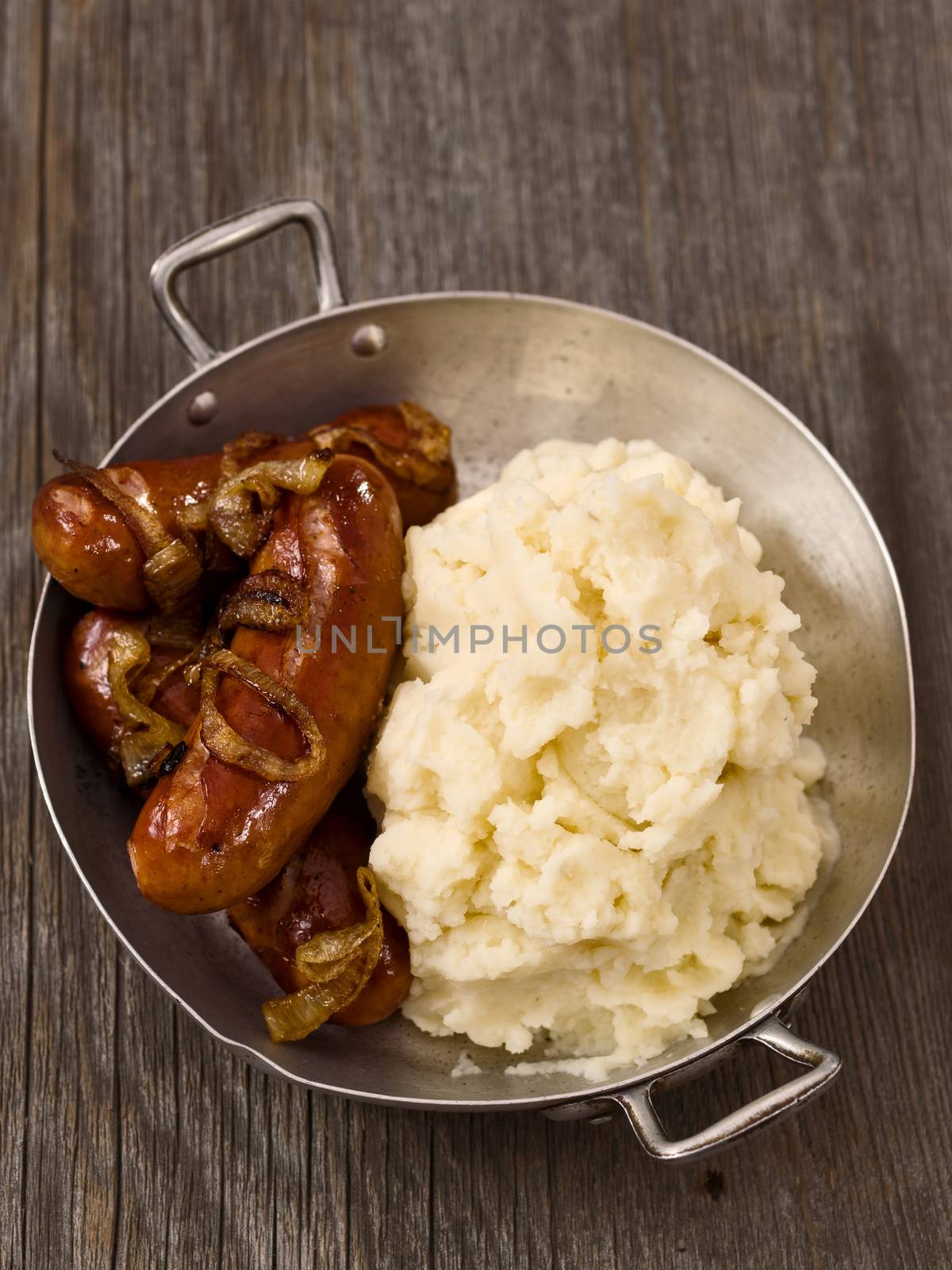 close up of rustic english pub grub bangers and mash