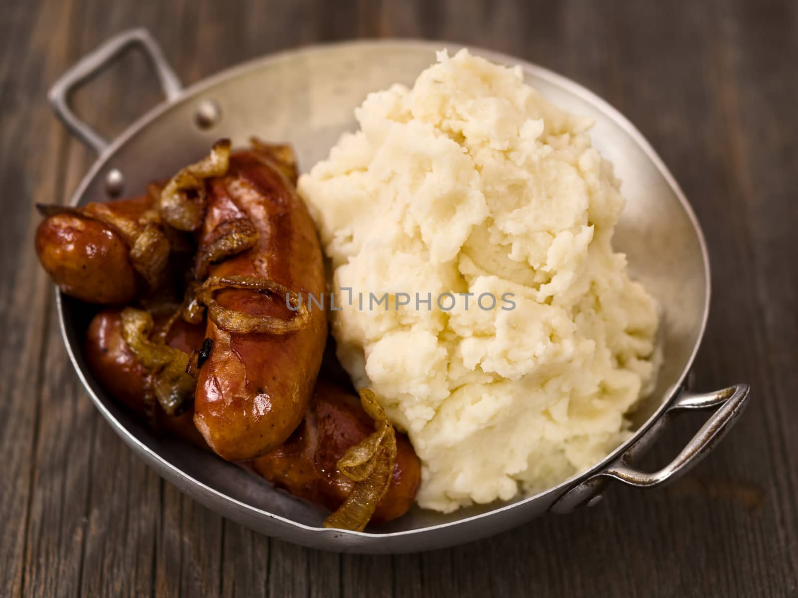 close up of rustic english pub grub bangers and mash