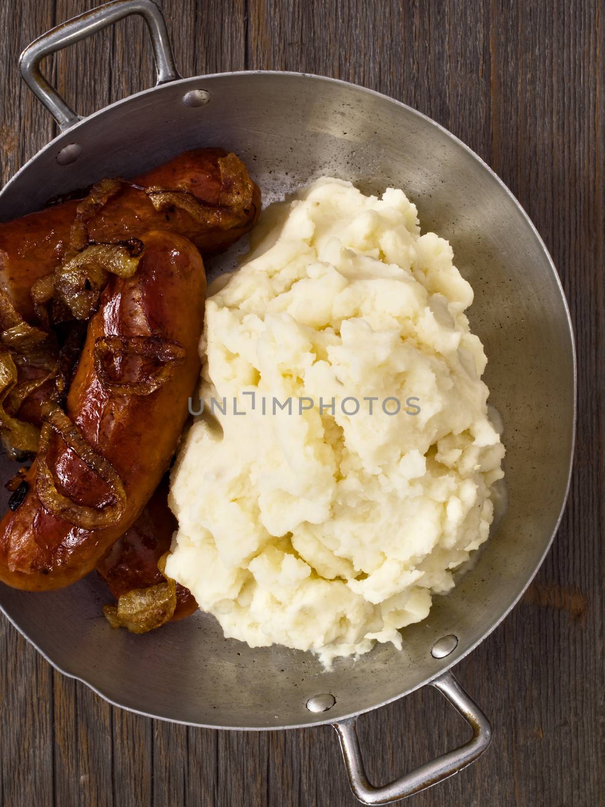 close up of rustic english pub grub bangers and mash