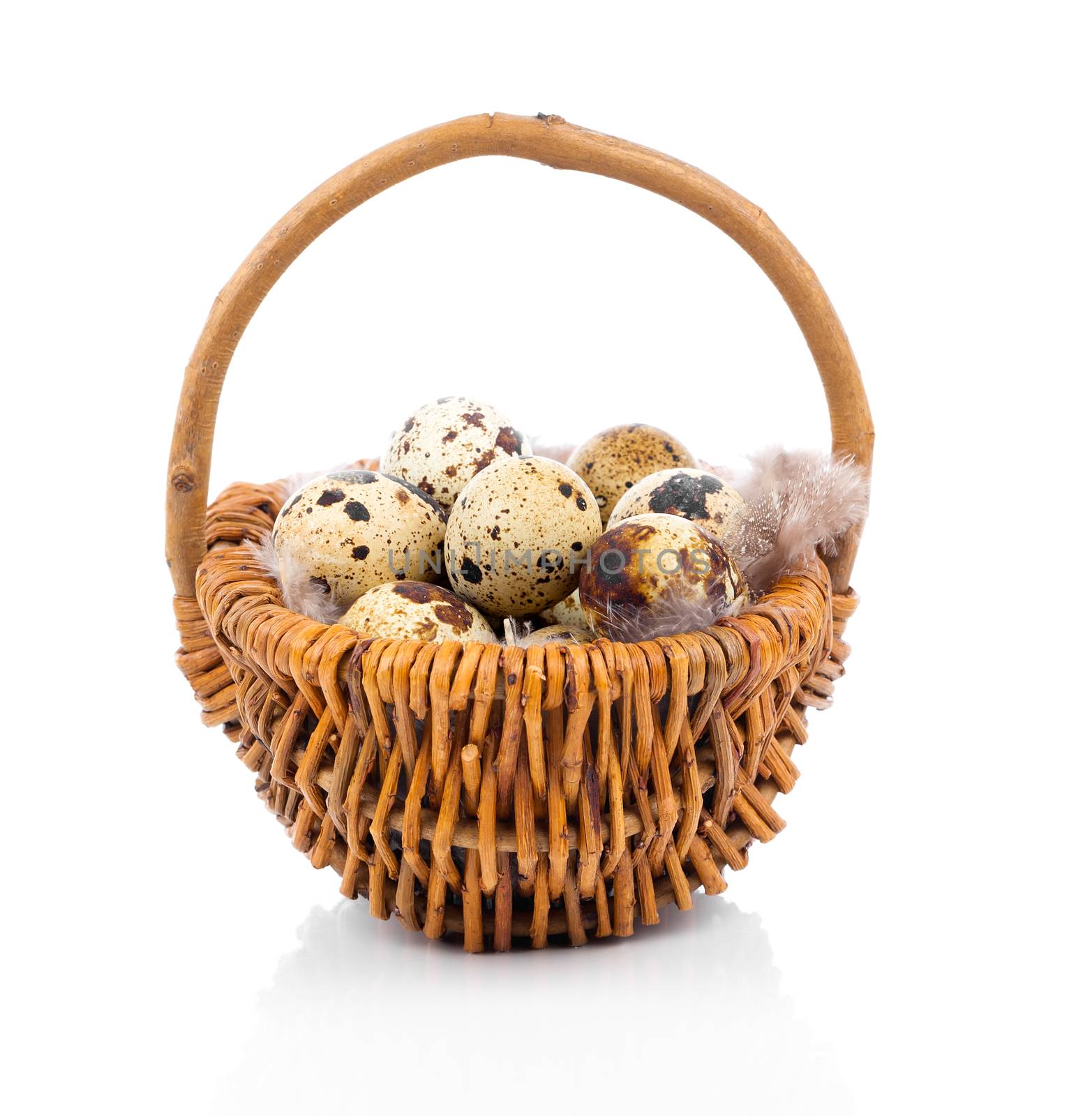 quail eggs in basket, on white background