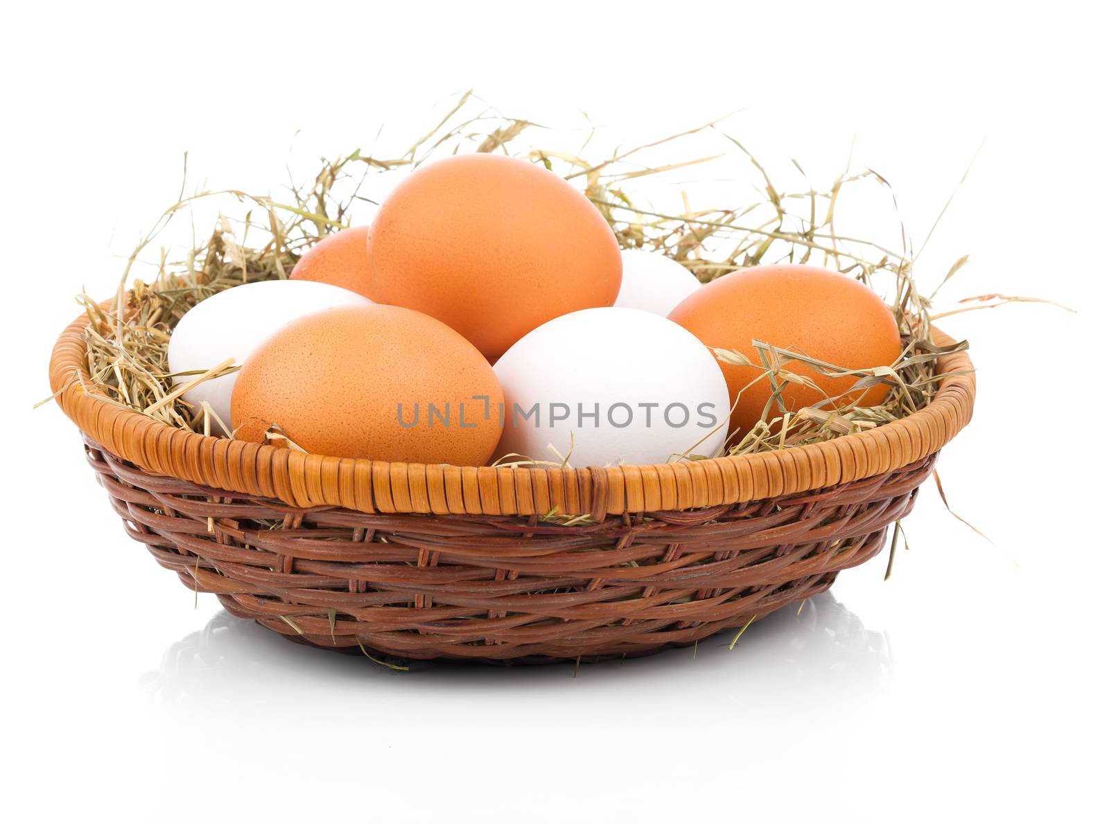 Eggs in basket isolated on white background by motorolka
