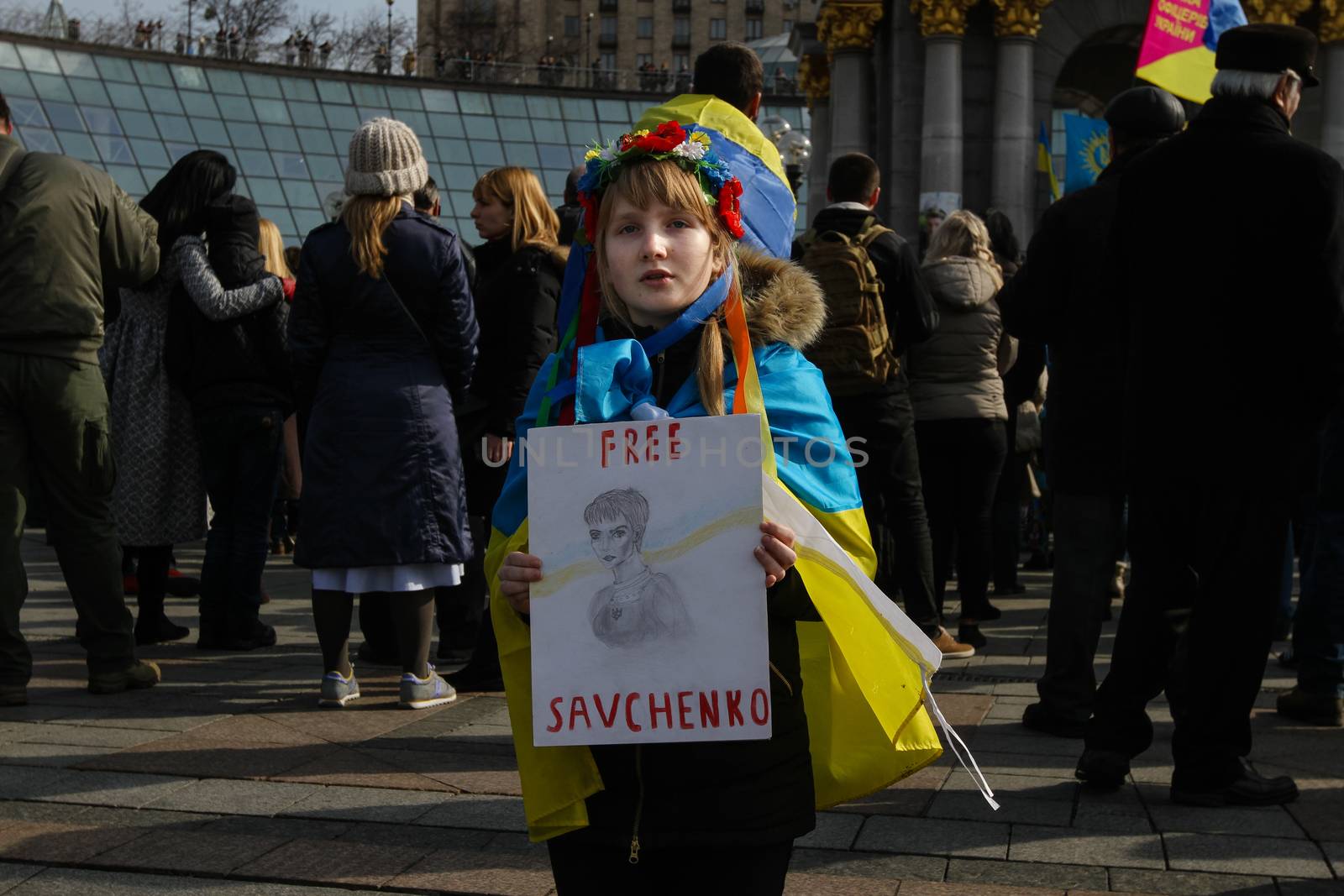 UKRAINE, Kiev: A girl holds a placard with a portrait of Nadiya Savchenko, which says Free