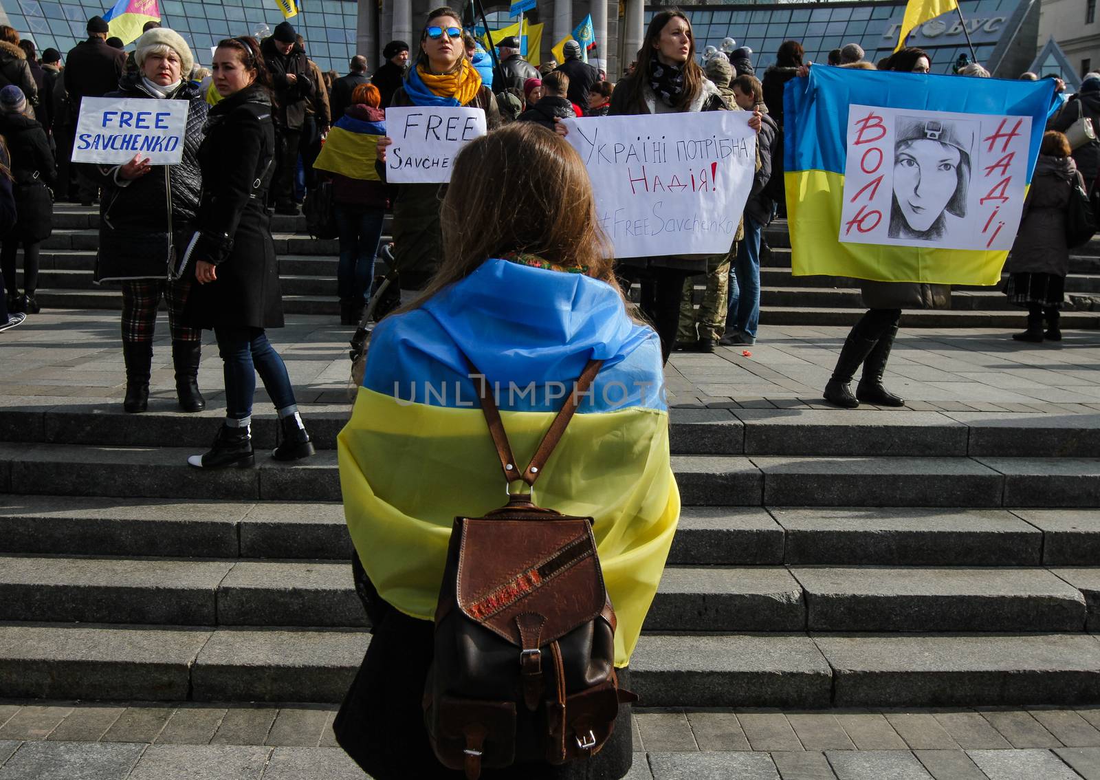 UKRAINE, Kiev: A girl holds a placard with a portrait of Nadiya Savchenko, which says Free