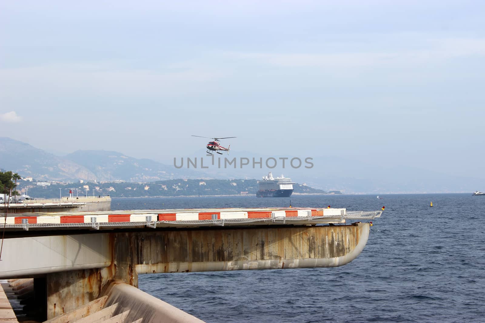 Fontvieille, Monaco - October 24, 2015: A Helicopter Landing at the Heliport of Monaco. District of Fontvieille in the Principality of Monaco