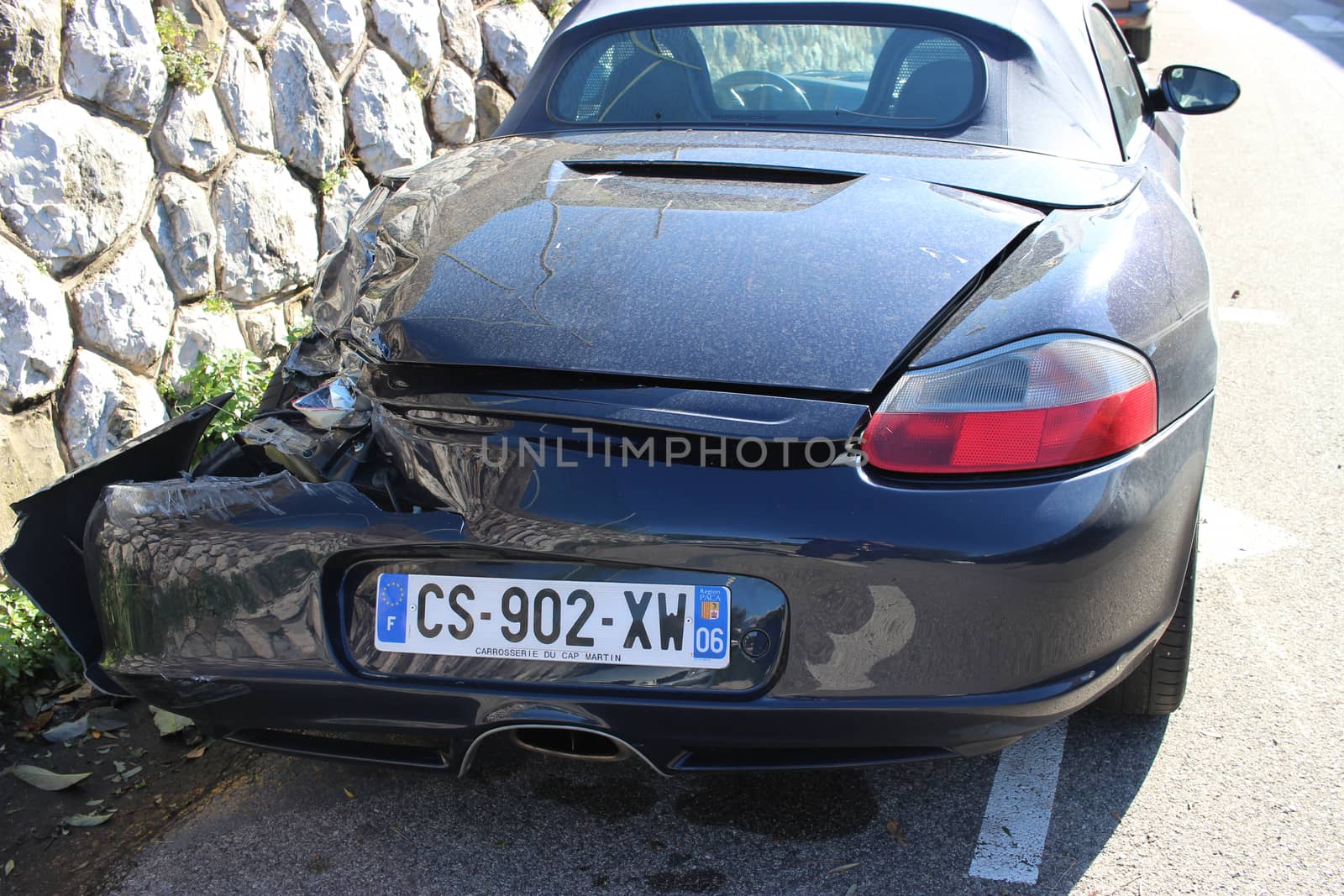 Roquebrune-Cap-Martin - March 1, 2016: Sport Car Crash Rear View. Luxurious Porsche 911 Roadster Parked in the Street after an Accident. South of France