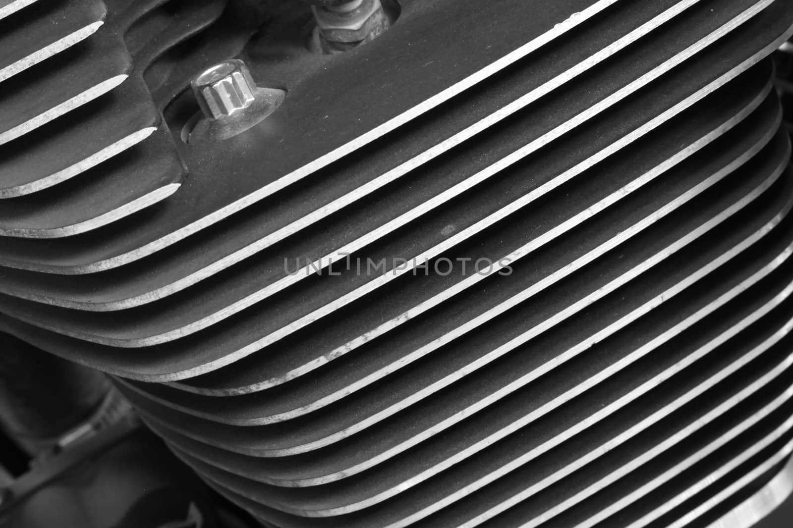 close up cylinder fins of motorcycle black and white style by worrayuth