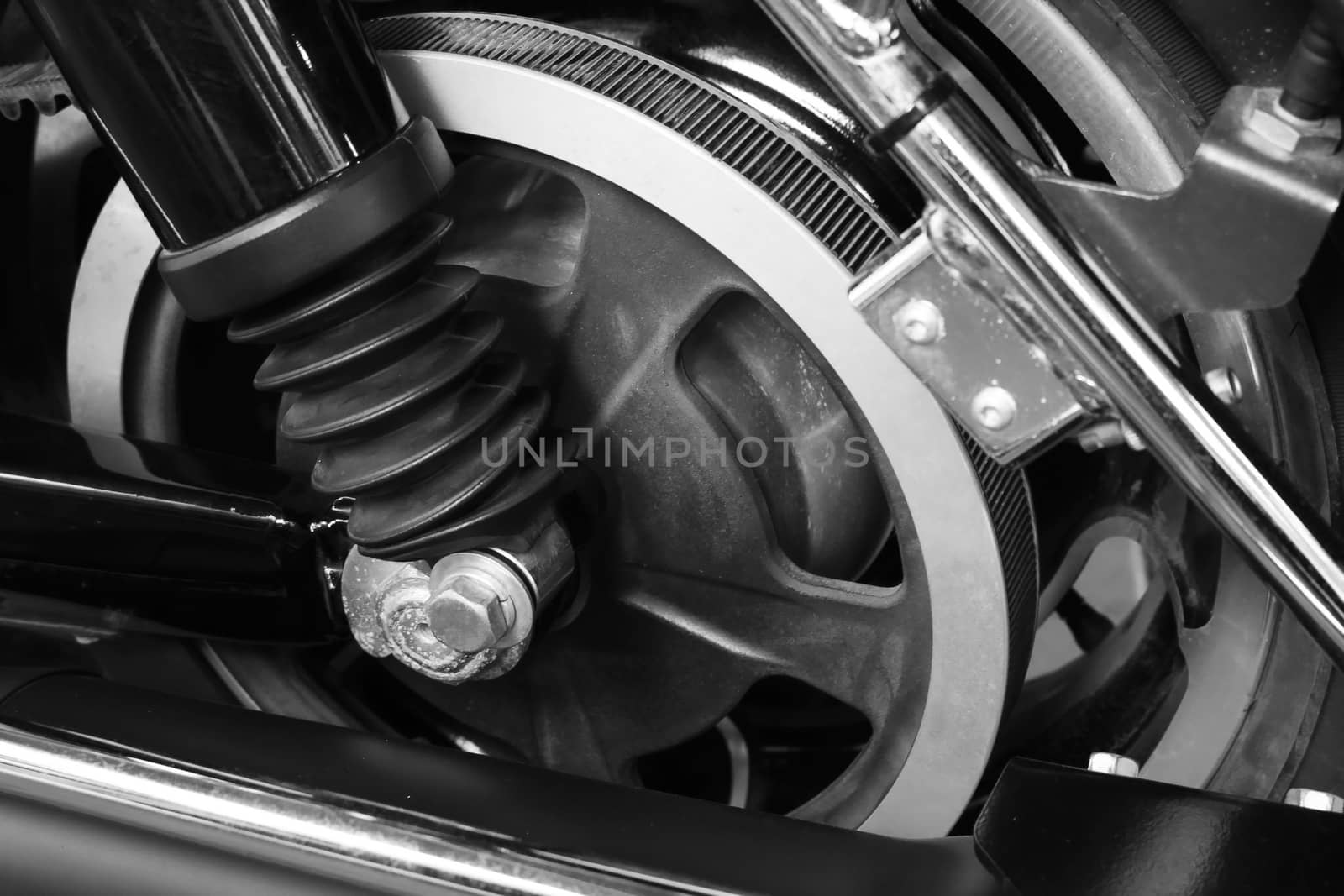 Close up belt drive wheel in the motorcycle black and white style by worrayuth